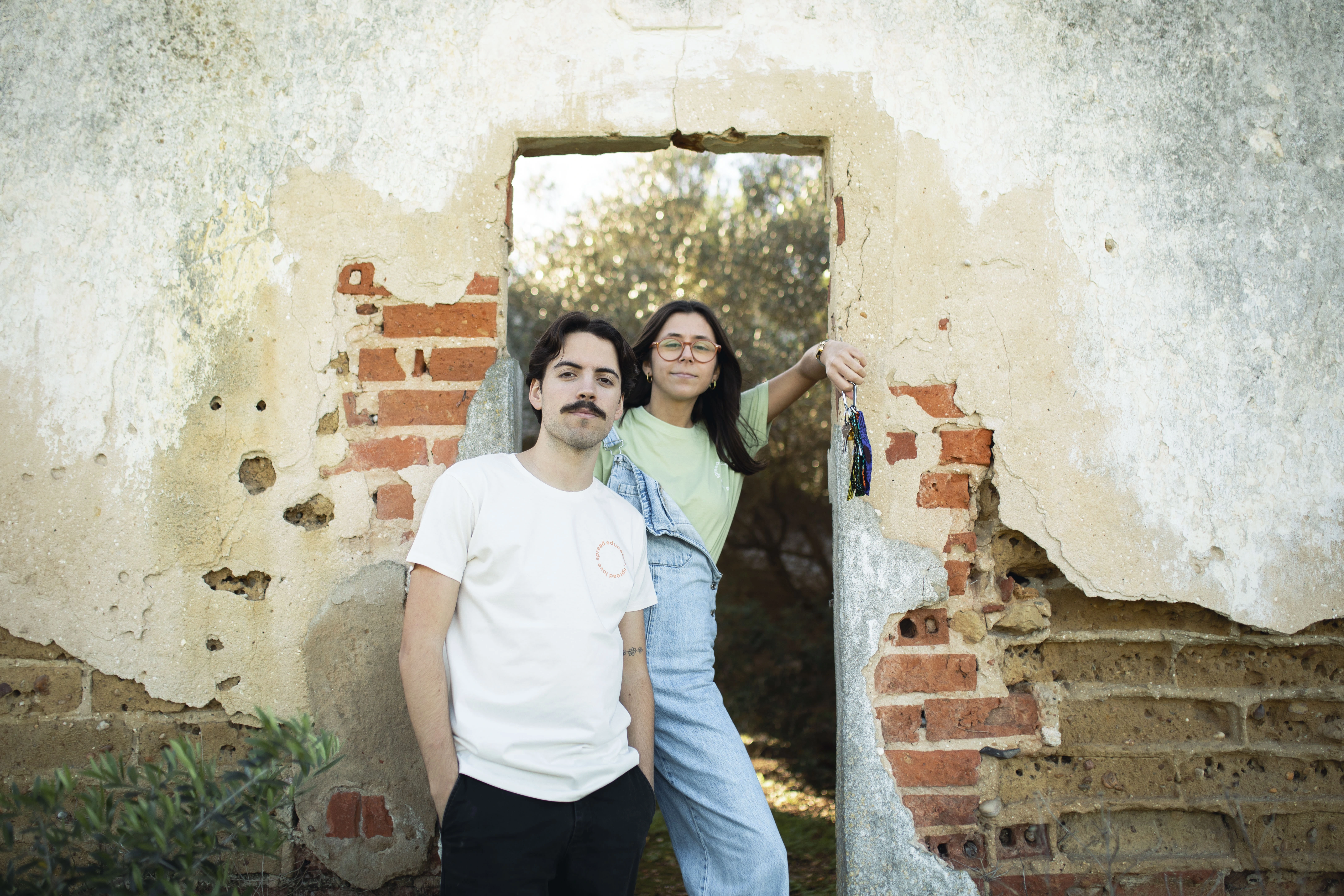 Couple by brick wall